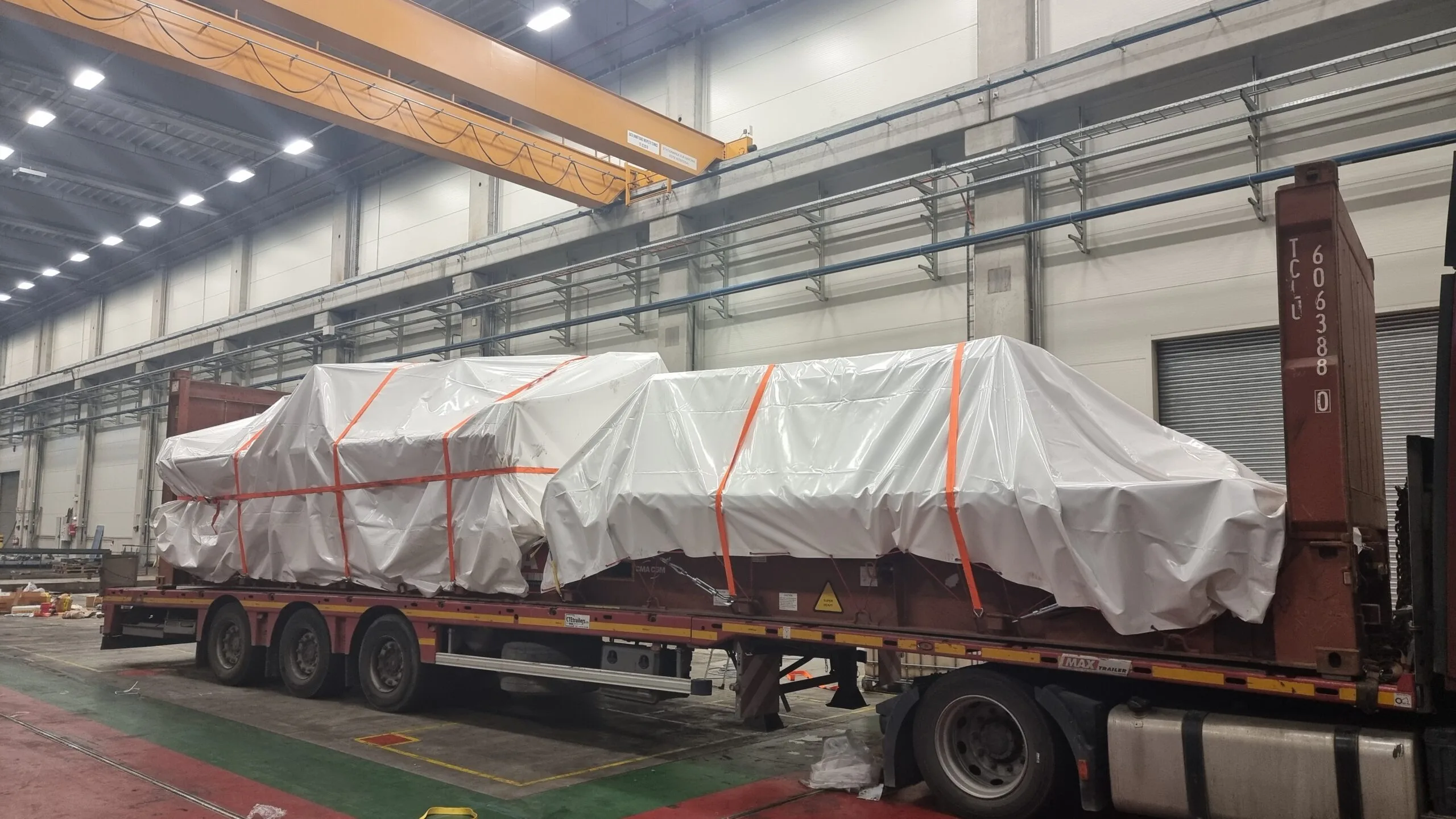Machine secured on a trailer